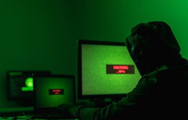 Anonymous hacker running malware