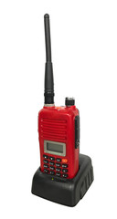 Red portable radio transceiver with long antenna and charger isolated on white background cliping path included.