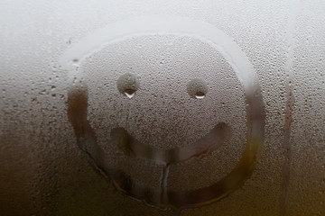The face of a man painted on glass
