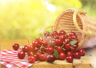 Ripe Cherry basket  on background