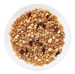 Muesli with raisins on a plate top view isolated on white background with clipping path.