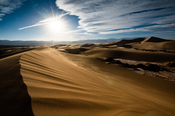 Death Valley sand dune in contrasted morning light. The sand dunes of the National Park in USA are a sight to see. The extreme heat and dry conditions merge with the wind to create this desert