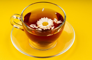 cup of tea with chamomile flowers