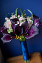 dramatic bridal bouquet on blue background