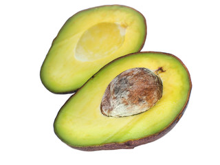 Avocado cut in half on a white background.