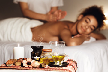 Woman enjoying aromatherapy massage in luxury spa - obrazy, fototapety, plakaty
