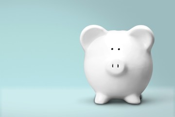 Hand putting coin to piggy bank