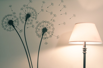 Floor lamp next to dandelion flower wall decal - Powered by Adobe