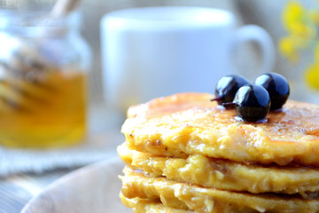 Stack of oatmeal pancake with honey and berries Healthy delicious breakfast