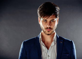 Portrait of pensive handsome man front of him