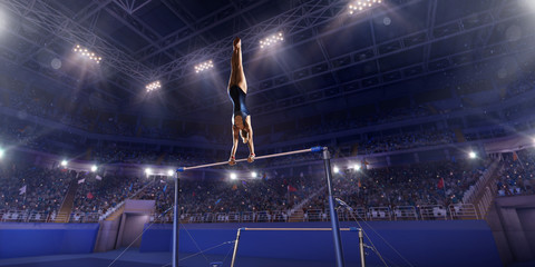 Female athlete doing a complicated exciting trick on horizontal gymnastics bars in a professional...