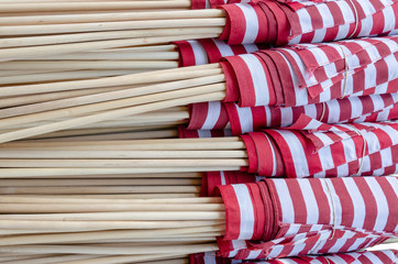 Many Rolled Up US Flags Horizontal