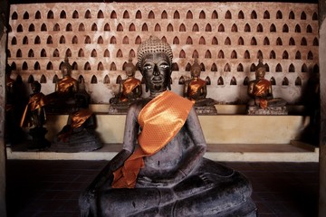 Laos style Buddha statue in Vientiane capital city. black statues Buddhist art in a grand temple....