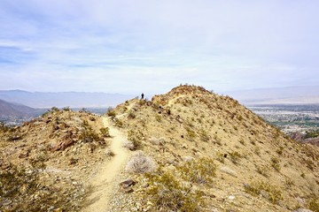 distant hiker on trail in Palm Springs mountains