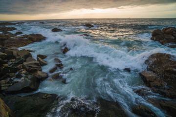 Fototapeta premium Ocean scenery with powerful waves at sunset
