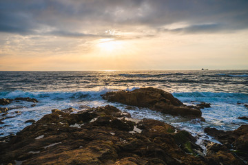 Ocean scenery with powerful waves at sunset