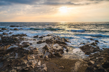 Ocean scenery with powerful waves at sunset