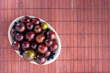 fruits of jaboticaba in bowl on the table