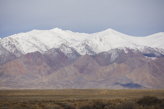 Stock image desert landscape with mountain snow