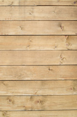 New varnished wooden wall closeup