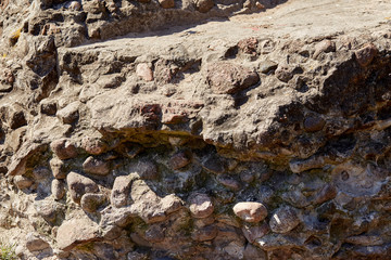 Background wall made of stones held together with cement.