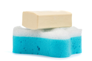 Soap and blue washcloth on a white background