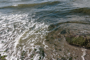Overhead view of beach waves and foam v5