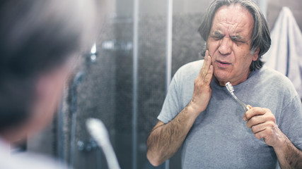 Old man with toothache