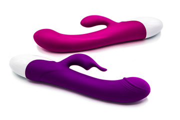 Sex toys. Vibrators purple and pink isolated on white background