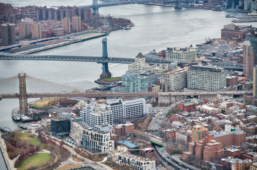 New York City from helicopter point of view. Brooklyn and Manhattan Bridges with Manhattan...
