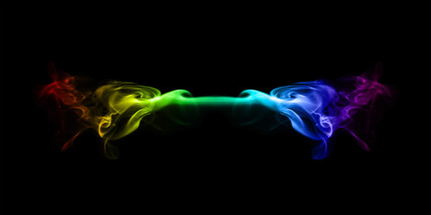 abstract colorful smoke isolated on black background closeup