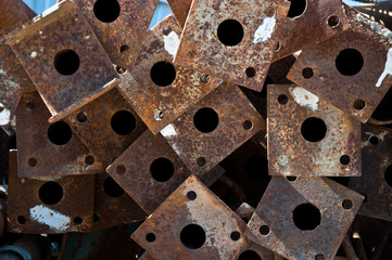 Metal pipes in a pack. Material storage at the construction site.
