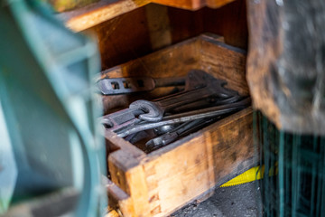 Old rustic tools in a box isolated 