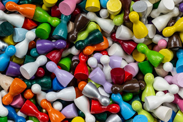 Colorful Patterns: many different colored game figurines as background