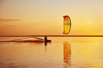Kitesurfing at sunset - obrazy, fototapety, plakaty