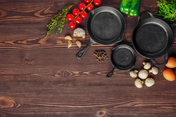 Cast-iron pan and spices, view from above