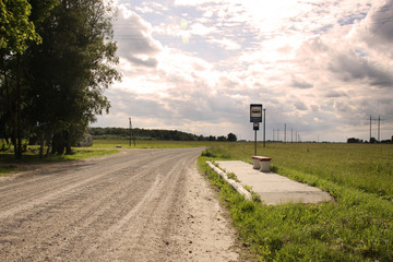 Bus stop in Lithuania village gravel road