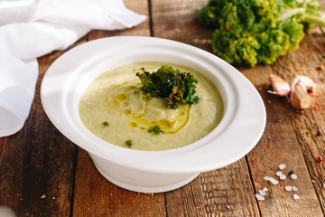 Cauliflower cream soup. Oil and cabbage. Wooden. Kitchen. Homemade. Dieting. Healthy food.