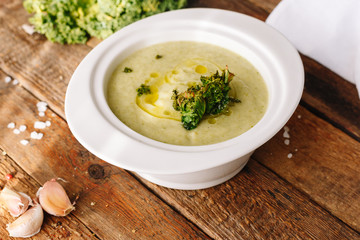 Cauliflower cream soup. Oil and cabbage. Wooden. Kitchen. Homemade. Dieting. Healthy food.