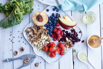 Nuts and berries. Ingridients. Blueberry, strawberry, plate, apple, apricot raspberry. Fresh. Organic. Vitamin. Breakfast. Healthy food. 