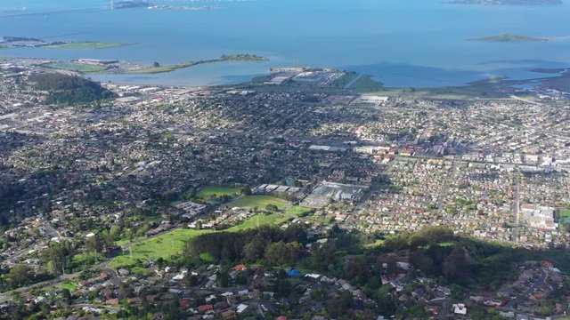 An aerial view of the congested East Bay cities of Berkeley, Oakland, El Cerrito and San Francisco Bay shows how densely populated this urban area is. 