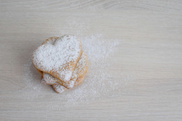 gingerbread in the shape of hearts on a bright table