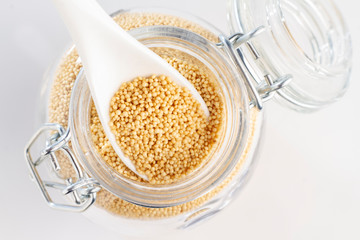 amaranth beans in spoon and glass bowl