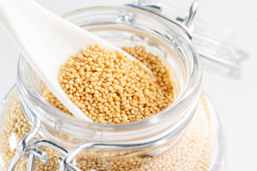 amaranth beans in spoon and glass bowl
