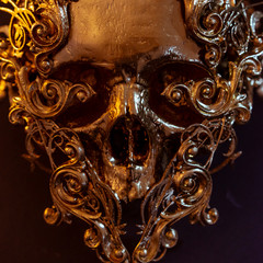 Skeleton, golden skull made with 3d printer and pieces by hand. Gothic piece of decoration for halloween or horror scenes