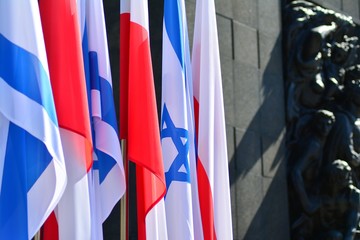 Poland and Israel flag waving in the wind. Israel and Poland two flags textile cloth.