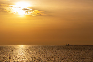 Golden summer Adriatic Sea sunrise with a ship at Senigallia, Province of Ancona, Marche, Italy