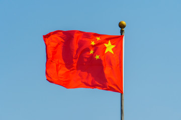 Naklejka na ściany i meble Five-star Red Flag waving against clean blue sky, Chinese flag against clear sky
