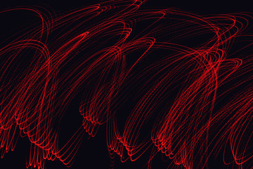 Abstract neon lights trails in the black background. Futuristic overlay light pattern.
