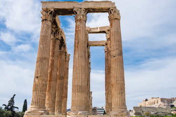 Ruins of the ancient Temple of Olympian Zeus in Athens with Acropolis hill in the background